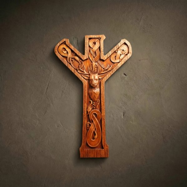 A high-end wooden wall carving in the shape of the Algiz rune, featuring a noble stag's head at the center. The rune is decorated with flowing Celtic knotwork and serpentine scrolls. Hand-carved from a single piece of wood with a warm, natural finish that highlights the artisan's detail.