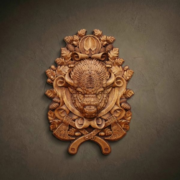 Hand-carved Iroko wood Bison head wall plaque surrounded by oak leaves and acorns. Detailed wildlife wood carving featuring crossed axes and buffalo hoof prints. Premium solid hardwood relief for rustic home decor or hunter's lodge, showcasing intricate artisan craftsmanship.