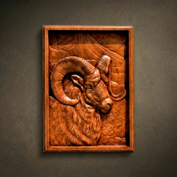 Custom hand-carved Iroko wood relief sculpture of a Bighorn Sheep. This highly detailed wildlife carving features a majestic ram with massive curved horns and realistic fleece textures, set within a carved rectangular frame. Finished with natural oil to emphasize the rich wood grain. A premium example of bespoke mountain wildlife art and custom-made animal wood carvings available for order.