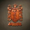 Custom hand-carved Iroko wood family crest for the name "HAYES". This bespoke heraldic relief features a central shield with a serpent coiled around a sword, topped with a knight's helmet and ornate acanthus leaf mantling. Finished with natural wax to enhance the premium wood grain. A fine example of personalized family heritage art and luxury custom wood carvings.