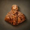 Masterpiece high-relief wood carving of a fierce Viking Jarl with detailed braided hair and beard. Hand-sculpted from premium Jatoba wood by Oleg Krotko for Forged in Wood, this artisan bust showcases extraordinary anatomical detail and rich wood grain. A luxury collector's piece and a pinnacle of Norse-inspired woodcraft, perfect for high-end interior galleries.