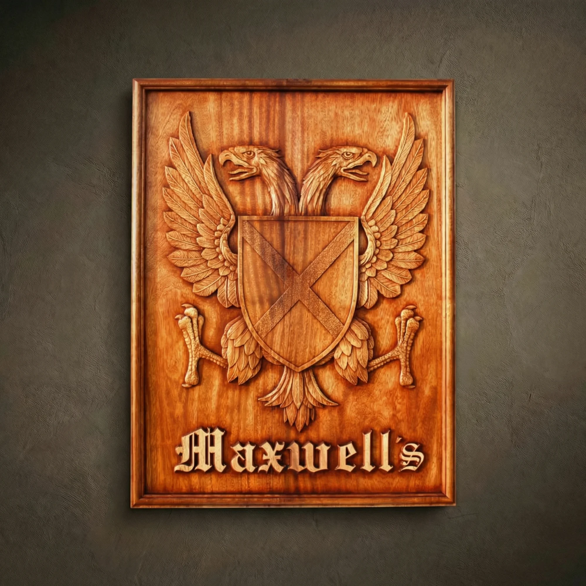 Custom hand-carved Iroko wood family plaque for the name "Maxwell's". This bespoke heraldic relief features a double-headed eagle holding a shield with a saltire cross. The rectangular panel includes Gothic-style lettering at the bottom. Finished with natural wax to highlight the premium wood grain. A high-end example of custom-made family legacy art and personalized wooden wall decor.
