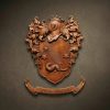 Custom hand-carved Iroko wood family crest for the name "ARMILLEI". This bespoke heraldic relief features a central shield with a shooting star (comet), three stars, and a ferret or ermine. The shield is topped with a crowned knight's helmet and surrounded by lush acanthus leaf mantling. Finished with natural wax to showcase the rich wood grain. Premium personalized family heraldry and custom wooden wall art.