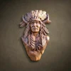 High-relief wall bust of a Native American Chief hand-carved from solid Iroko hardwood. Features a traditional eagle feather war bonnet with integrated horns and intricate beaded necklaces. Detailed facial features showing age and wisdom. Natural amber-brown oil finish highlights the dense grain of the Iroko wood. A museum-quality masterpiece for luxury interiors or private collections.